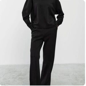 Black sweat set with crewneck cropped top and wide leg bottoms